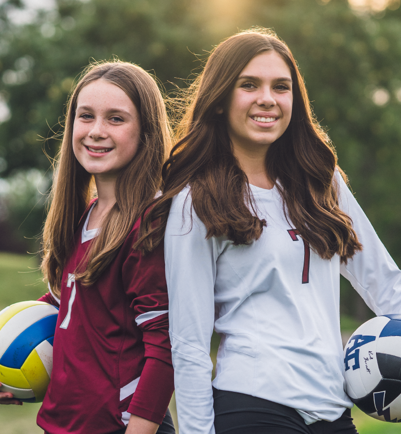 Kids playing volleyball with retainers